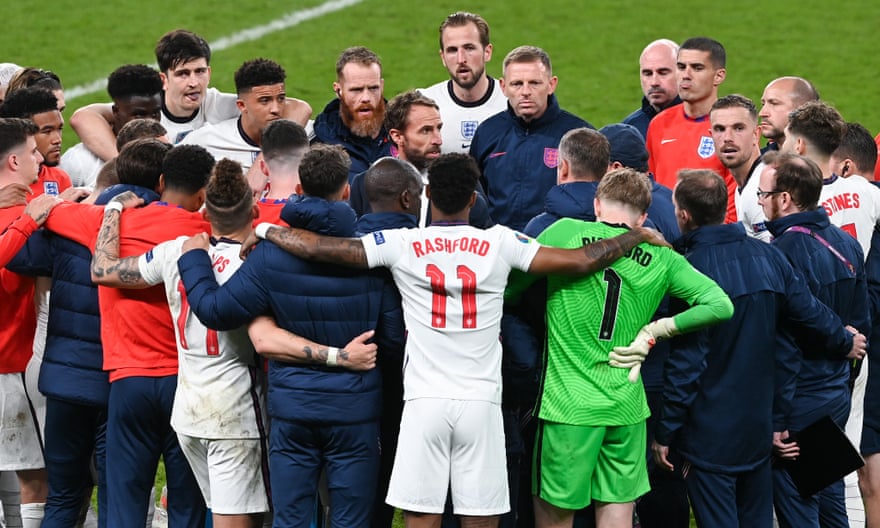 Gareth Southgate addresses his players and staff during a team huddle before the penalty shootout against Italy in the Euro 2020 final.