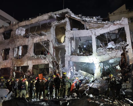 Emergency services at the scene after a building was struck by a Iranian missile in Tel Aviv.