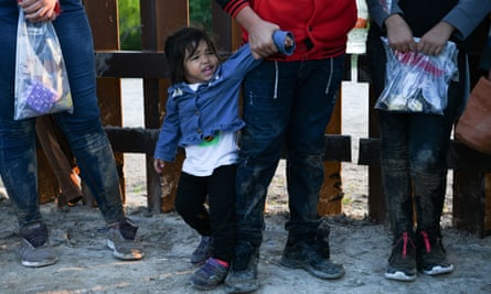 Central American migrants turn themselves in to the US border patrol as they seek asylum in Texas.