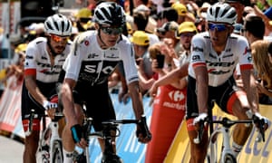 Chris Froome crosses the line, showing some of the results of his crash.