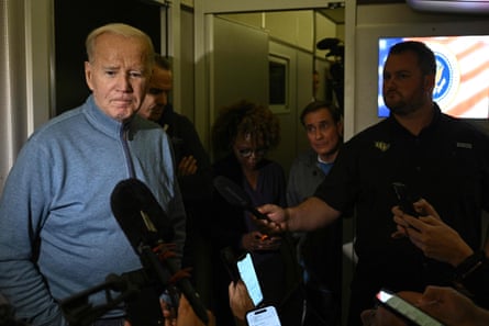 Joe Biden speaks to members of the media onboard Air Force One
