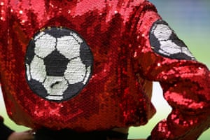 A close up detail shot of the jacket of one of Robbie’s backing dancers