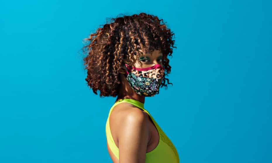 Model wearing three different fabric face masks
