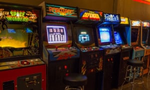Line up of classic 70s and 80s arcade games, including Street Figher, Defender and Bubbles, at the Vector Volcano Classic Arcade in Bend, Oregon, US