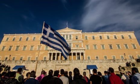Greeks protest against austerity outside the parliament building in Athens