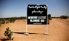 A sign on a road to Gao, northern Mali, reads ‘welcome to the Islamic state of Gao’