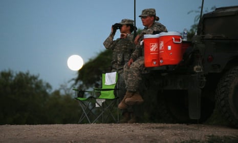 Members of the national guard patrol along the Rio Grande at the Texas-Mexico border in Rio Grande City, Texas.