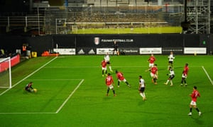 Ademola Lookman of Fulham sees a shot saved by Manchester United goalkeeper David de Gea.