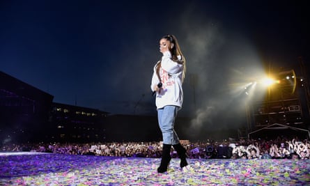 ‘We put a lot on her shoulders’ ... Grande wipes away a tear as she performs at One Love Manchester, Old Trafford cricket ground, 4 June 2017.