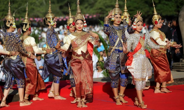 Cambodian dancers perform during a prayer ceremony in front of Angkor Wat temple.
