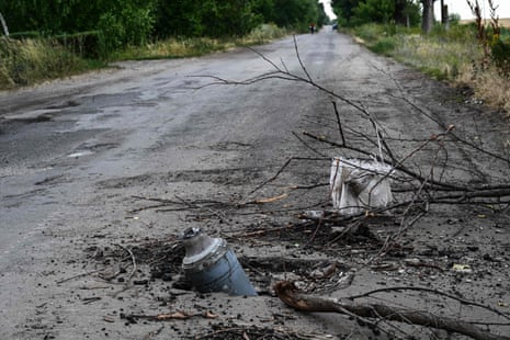 A Russian rocket half sunk in the middle of a road in the countryside of Siversk, Donetsk, on 8 July 2022.