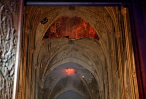 Flames and smoke are seen inside Notre Dame Cathedral
