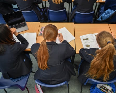 Private school pupils sit down during lessons