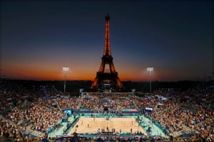 A beach volleyball match under the Eiffel Tower