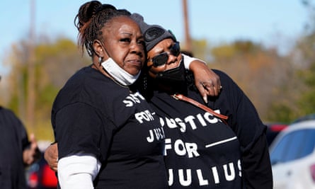 Relatives of Julius Jones embrace after Oklahoma’s governor granted clemency for Jones.