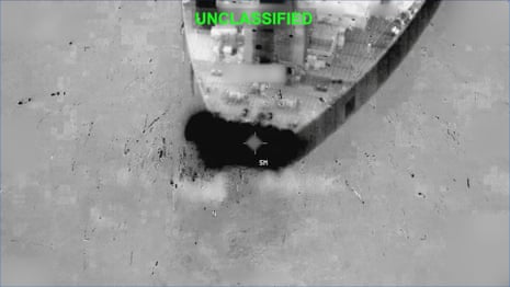 Black and white image from night vision footage showing an explosion on what looks to be a ship.