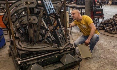 Akym Kleymenov works on a mortar system at the workshop.