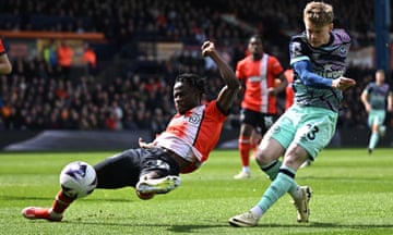 Brentford's Keane Lewis-Potter in action with Luton Town's Issa Kabore.