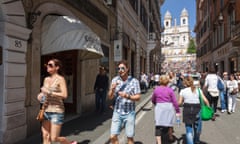 Tourists walk past Cafe Greco at Via Condotti with Spanish steps in background. Rome, Italy<br>F4DB20 Tourists walk past Cafe Greco at Via Condotti with Spanish steps in background. Rome, Italy
