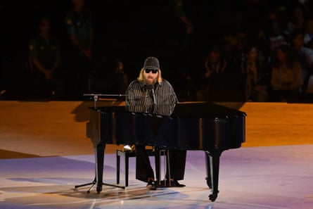 Sébastien Tellier at a piano on a stage.