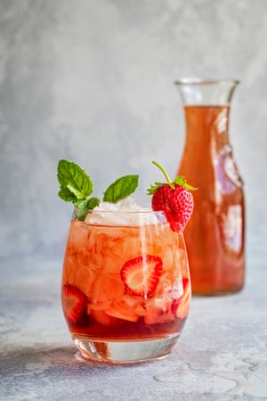 A summer cocktail with strawberries.