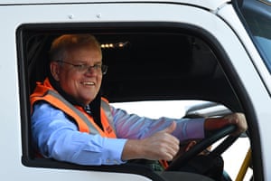 Australian Prime Minister Scott Morrison gestures from a truck during a tour of PACCAR Kenworth in Melbourne, Wednesday, May 19, 2021.