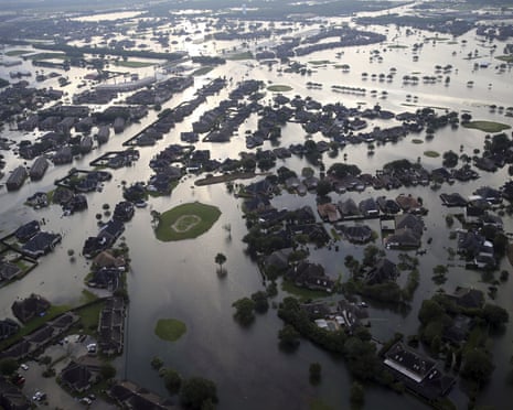 2017 AP YEAR END PHOTOS - Floodwaters from Tropical Storm Harvey surround homes in Port Arthur, Texas, on Aug. 31, 2017. The storm, which later became a hurricane, dumped record rainfall throughout the Houston area. (AP Photo/Gerald Herbert)