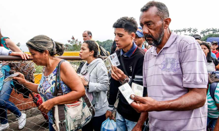 Venezuelans cross the Simon Bolivar International Bridge into Colombia. His detractors blame him for the country’s economic crisis, which has caused 2.3 million to flee the country since 2015.