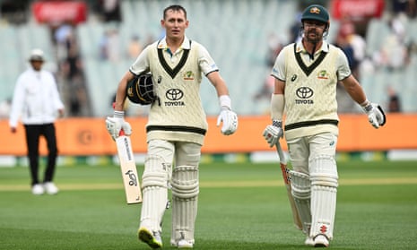 Marnus Labuschagne and Travis Head walk from the field at the end of day one of the Boxing Day Test between Australia and Pakistan