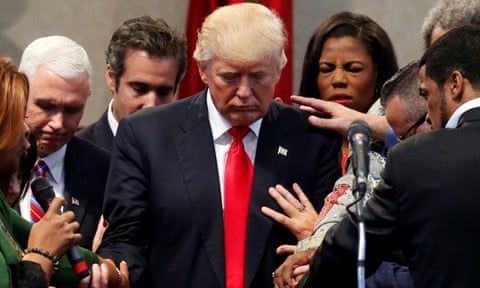 Members of the clergy lay hands and pray over Donald Trump at the New Spirit Revival Center in Cleveland Heights, Ohio in September 2016.