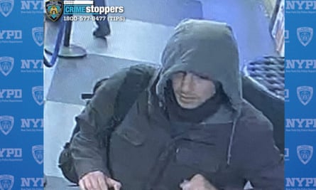 a man in a coat and sweatshirt