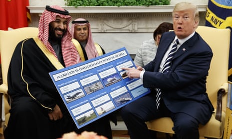 Donald Trump brandishes a chart highlighting arms sales to Saudi Arabia as he sits with crown prince Mohammed bin Salman.