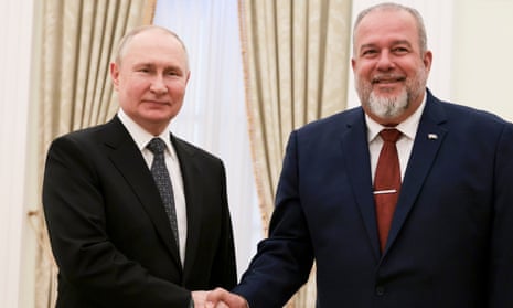 Russian President Vladimir Putin, left, poses for a photo with Cuba’s Prime Minister Manuel Marrero Cruz prior to their talks at the Kremlin.
