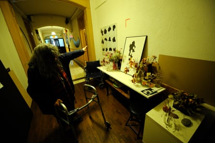 Bettina with some of her art in a Chelsea Hotel corridor, 2011.