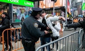 New York Police Department (NYPD) officer secures Times Square ahead of the New Year’s Eve celebrations in Manhattan