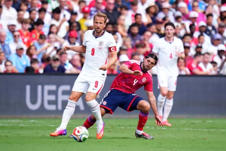 Harry Kane is challenged by Aaron Salazar.