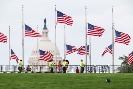 American flags are lowered to half staff by national park service staff around the Washington Monument in honor of Dolly Parton’s passing on 25 August 2026 in Washington DC.