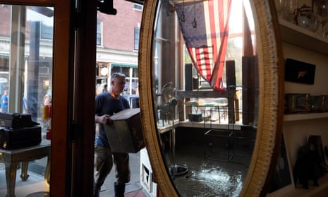 Simon Jennings, of Montpelier, Vt., removes furnishings and antiques from the flood-damaged store J. Langdon he shares with his wife in downtown Montpelier, Vt. Tuesday, July 11, 2023. A storm that dumped two months of rain in two days is brought more flooding across Vermont Tuesday.