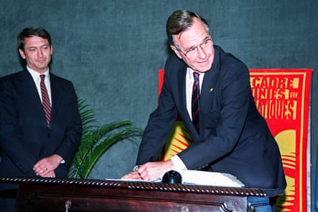 George HW Bush signs the UN Climate Change Convention in Rio de Janeiro, Brazil on 12 June 1992.