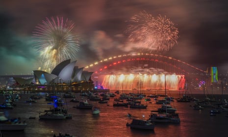 The 9pm fireworks are seen over the Sydney Opera House and Sydney Harbour Bridge during New Year’s Eve celebrations in Sydney, Australia.