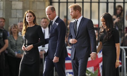 The Prince and Princess of Wales walk alongside Prince Harry and Meghan, Duchess of Sussex after viewing floral tributes for the Queen outside Windsor Castle on Saturday