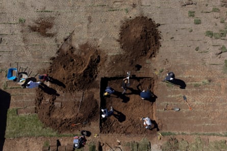 Members of the Legal Medical Service (SML) and workers participates in the forensic excavations to find the remains of Michael Woodward in Valparaiso, Chile.