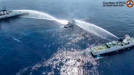 A still taken from video footage shows the Philippine Coast Guard ship BRP Bagacay being hit by water cannon from Chinese coast guard vessels near the Chinese-controlled Scarborough shoal in April 2024.