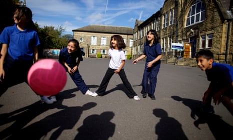 Pupils playing with ball in school
