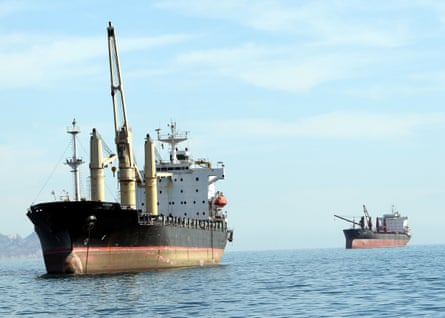 Two cargo ships crossing the sea