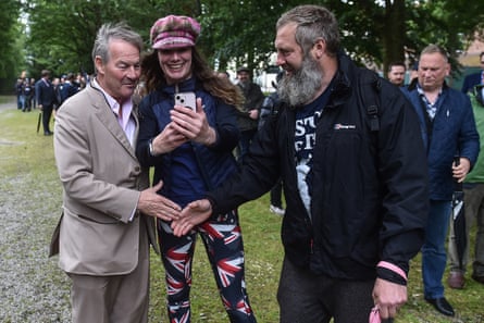 The Restore Britain leader, Rupert Lowe (left), meeting party volunteers, 13 June 2026.