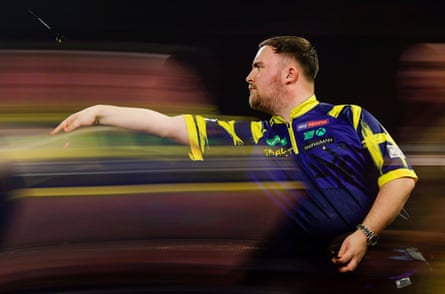 Luke Littler throws during his first round match against Darius Labanauskas during day one of the 2025/6 PDC World Darts Championship at Alexandra Palace.