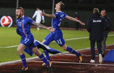 Iceland’s Aron Einar Gunnarsson and Jon Dadi Bodvarsson celebrate at the final whistle.