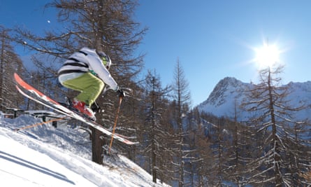 A teenage skier in mid-air descent atBardonecchia