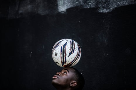 Bako Diarra from Mali with a football on his head.